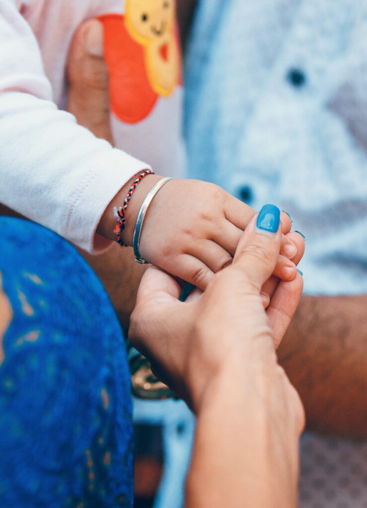 holding hands across generations