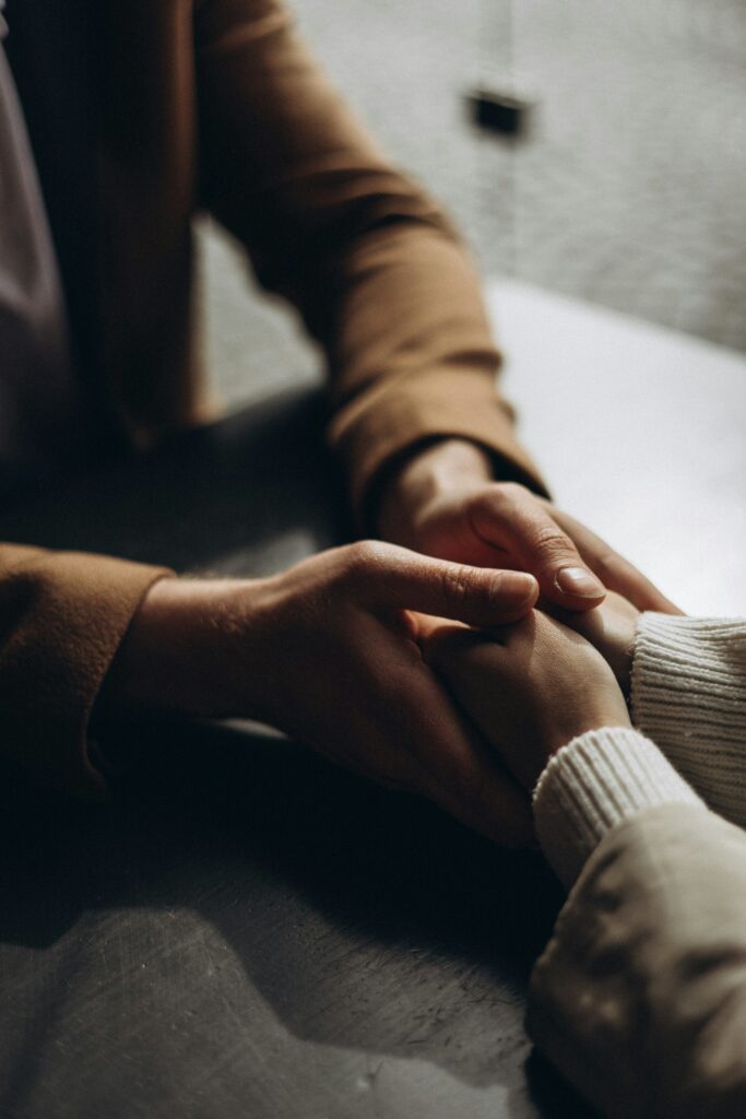 holding hands in support